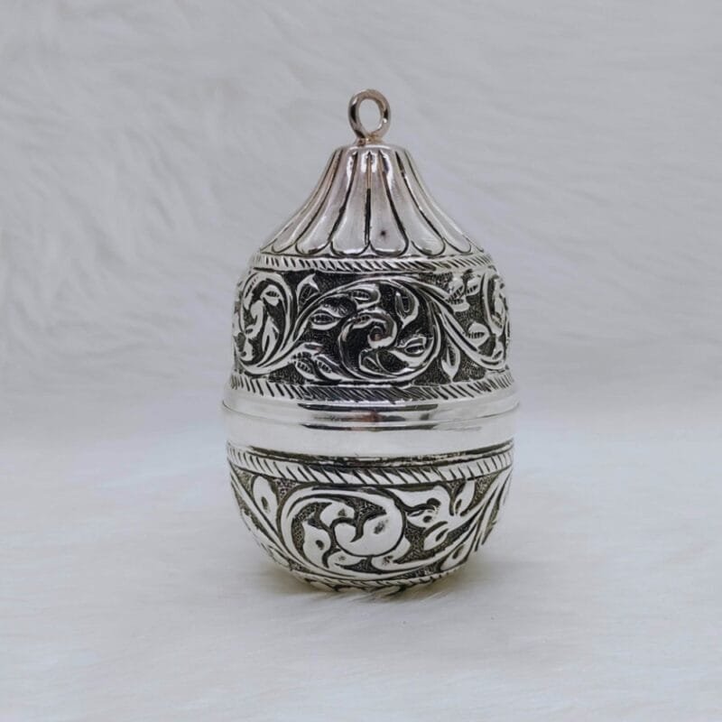 Real silver nariyal in antique carvings for pujan and by puran